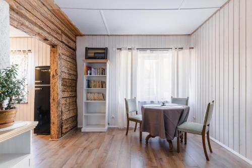 a dining room with a table and chairs at Rakvere Old Town Home in Rakvere