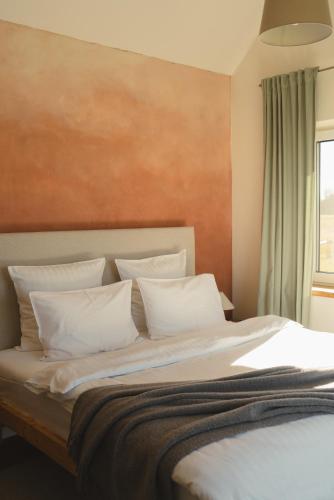 Postel nebo postele na pokoji v ubytování PAMIŠKĖ BOUTIQUE SPA