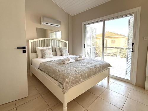 Ένα ή περισσότερα κρεβάτια σε δωμάτιο στο Onyx Beach Villa - Cozy 2BR - Walk to Beach