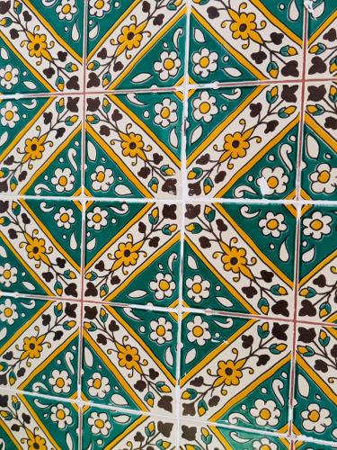 a tile floor with a pattern of flowers on it at La Maison de haut in Tunis