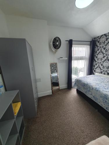 Ένα ή περισσότερα κρεβάτια σε δωμάτιο στο Private Room In Cardiff