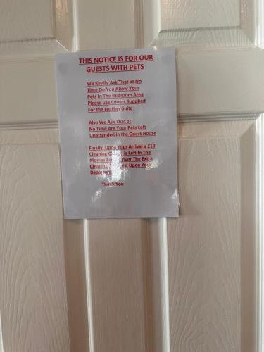 a sign on a door that says this notice is not our guests wildlife at Shropshire Guesthouse in Wolverhampton