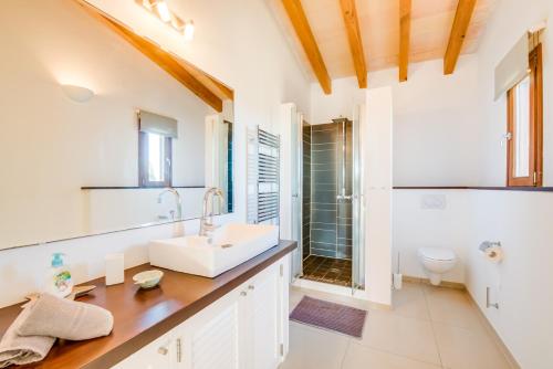 a bathroom with a sink and a toilet at Finca Mar des Teix in Manacor