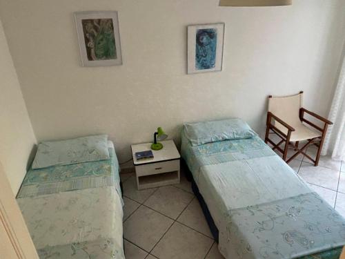 En eller flere senge i et værelse på La Brezza, relax nel verde con vista mare