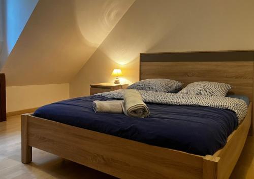 Ένα ή περισσότερα κρεβάτια σε δωμάτιο στο Au bois de la Belle