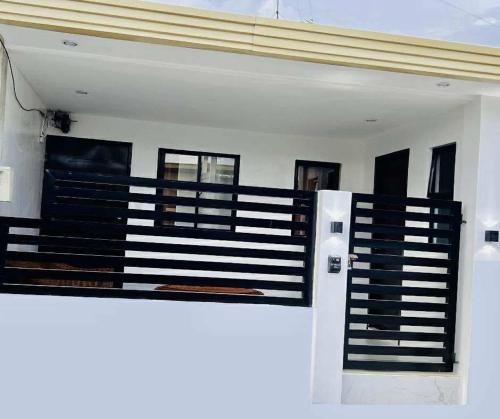 a room with a black and white fence at JMary Stayhouse in Nopol