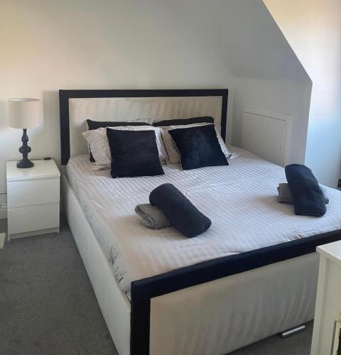 a large white bed with two pillows on it at Flat 2 Meadow view in Hurst