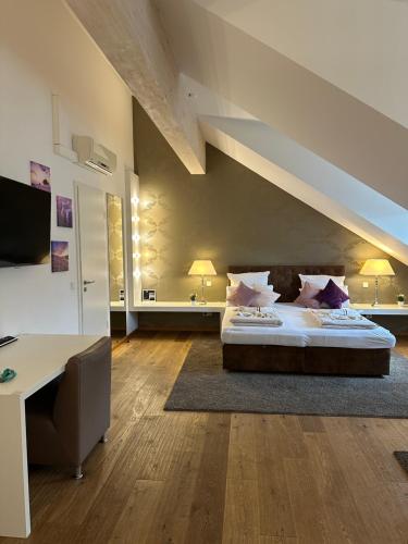 Postel nebo postele na pokoji v ubytování Haven Hotels - Helvetia Suites Düsseldorf City