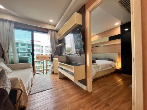 En eller flere senge i et værelse på DUSIT Grand Park GARDEN VIEW