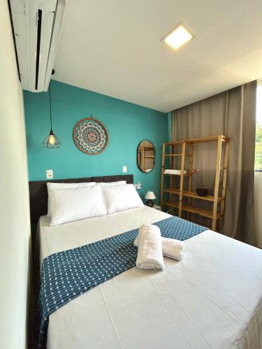 Ένα ή περισσότερα κρεβάτια σε δωμάτιο στο Alto da Pituba Flats