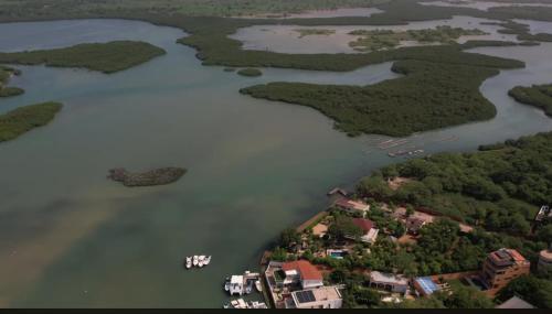 an aerial view of a lake with houses and islands at Luxurious 4 bedroom Villa next to the lagoon in Somone
