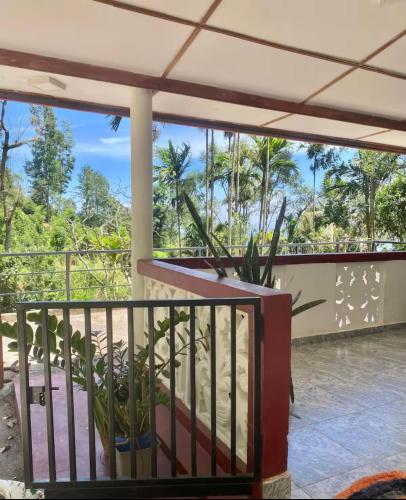 a balcony with a view of the jungle at Heart Whispering in Kandy