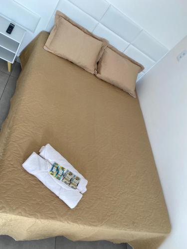 Ein Bett oder Betten in einem Zimmer der Unterkunft Chalé Por do Sol