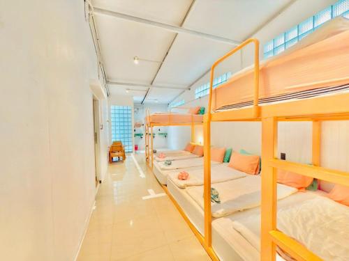 a group of bunk beds in a dorm room at Lazy Sunday Khaosan Hotel in Bangkok
