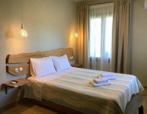 Postel nebo postele na pokoji v ubytování Erifyli near Mylopotamos in Pelion