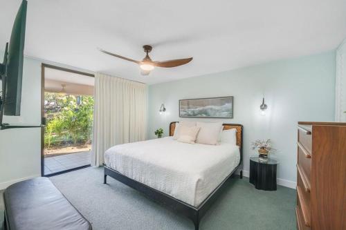 a bedroom with a bed and a ceiling fan at Wailea Ekahi 21A · WEK 21A Remodeled Wailea Condo Pool AC Near B in Wailea