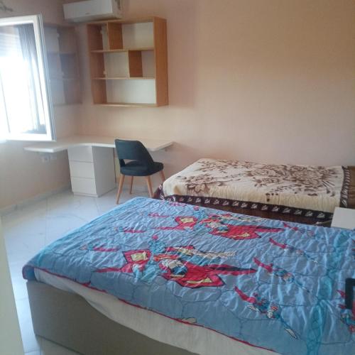 a bedroom with two beds and a chair in it at Casa privata in campagna 