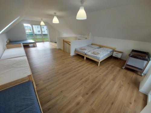 a living room with a bed and a desk at Domki letniskowe - U muzykanta in Chocianowice