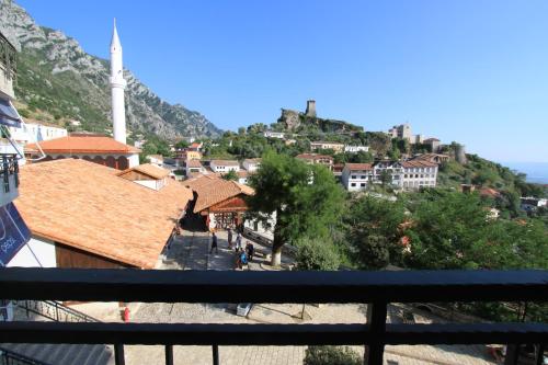 a view of a town with a mountain in the background at Hotel PANORAMA Kruje view on the castle and the old town in Krujë