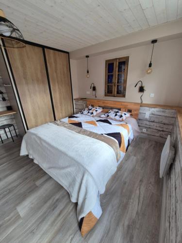 a bedroom with two beds in a room at Charmant appartement indépendant Ty-Oustal in Millau