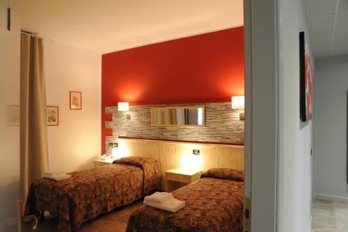 Postel nebo postele na pokoji v ubytování Hotel del Ponte