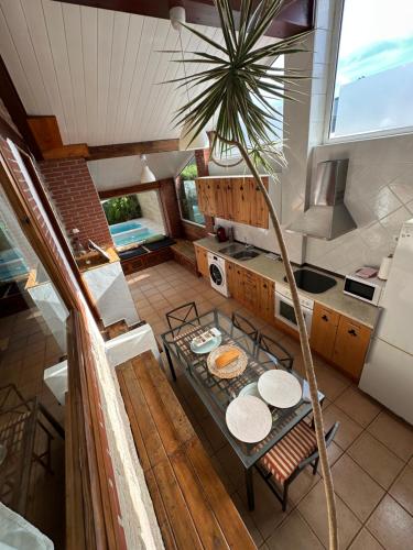 an overhead view of a kitchen with a table with plates at Villas Vairocana in Santillana del Mar