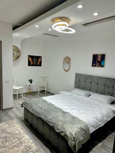 a bedroom with a large bed in a room at Le Charme Hostel in Bucharest