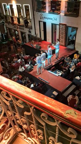a group of people standing on a stage in front of a crowd at Sollar da Chica in Diamantina