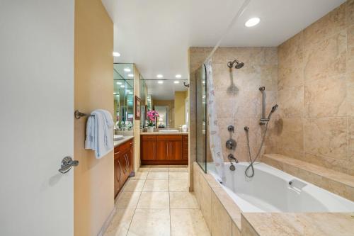 a large bathroom with a tub and a shower at Kapalua Ridge Villas 2721 in Kapalua