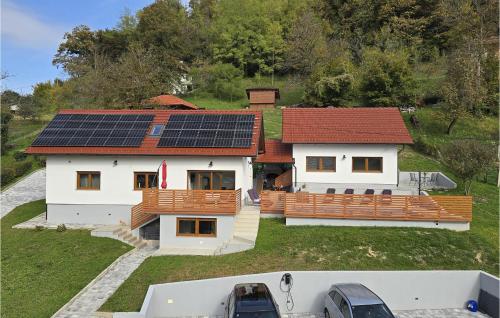 a house with solar panels on the roof at Holiday Home With Pool in Tuheljske Toplice