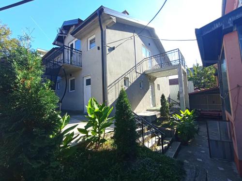 a building with a balcony on the side of it at Apartments & Rooms -MDL Lazić in Belgrade