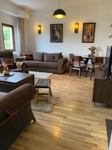 a living room with a couch and a table at Moun2 in Mavrovo