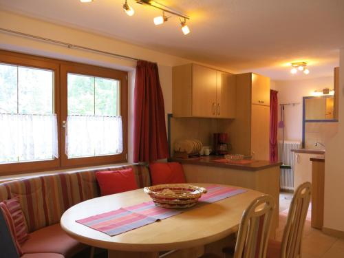 a kitchen and a table with a bowl on it at Gästehaus Judith in Längenfeld