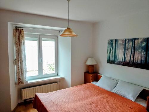 En eller flere senge i et værelse på Apartments Zlatko