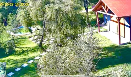 an overhead view of a garden with a building and a tree at Casa La Miel in Estación Cuñibal