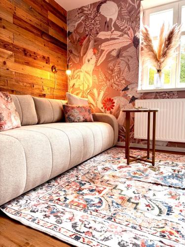 a living room with a couch and a table at Zeile Zwei - Kloster Zinna in Jüterbog