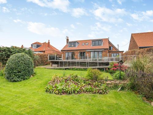 a large house with a large yard in front of it at Highfields in Runswick