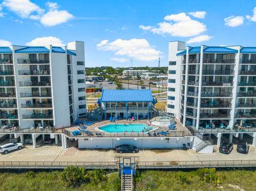 an aerial view of a resort with a pool and buildings at AquaVista Beach Resort by Panhandle Getaways in Panama City Beach