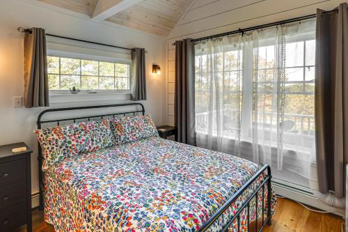 a bedroom with a bed and a large window at Sunny Stockton Springs Home Less Than 1 Mi to Beach! in Stockton Springs