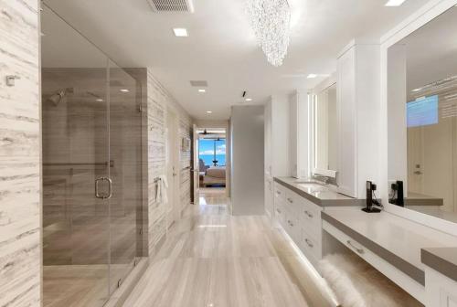 a bathroom with a walk in shower and a glass shower stall at Smart-home & Panoramic Water Views in Naples