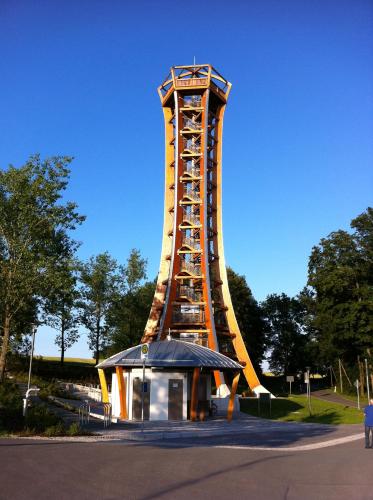 a large tower in the middle of a park at Ferienwohnung zum Ziemestal in Remptendorf