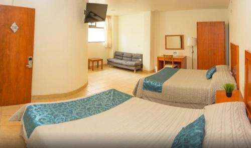 Una cama o camas en una habitación de Hotel Marllou