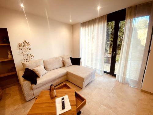 a living room with a couch and a table at Appartement Fiorentina in Saint-Avold