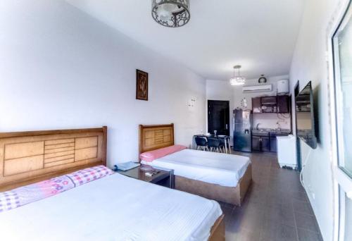 Ένα ή περισσότερα κρεβάτια σε δωμάτιο στο Porto Sharm El-Sheikh