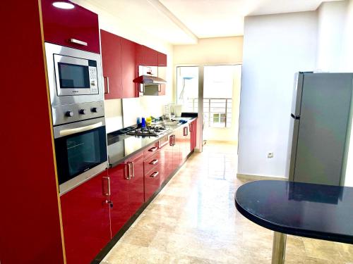 Η κουζίνα ή μικρή κουζίνα στο Reda's Apparts centre ville wifi 200 Mo