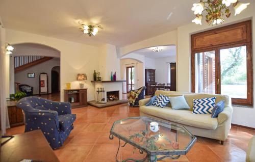 a living room with a couch and a table at Amazing Home In Castellabate With Wifi in Castellabate