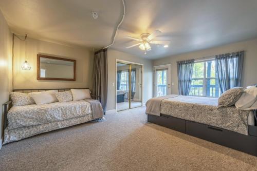 a large bedroom with a bed and a window at 28 Lodge in Hood River