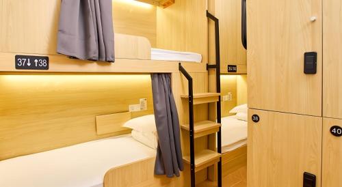 Ένα ή περισσότερα κρεβάτια σε δωμάτιο στο 深度青年旅舍