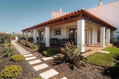 a house with a porch and a patio at Family & Friends in Sagres