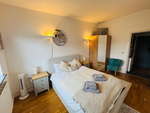 a bedroom with a bed with two towels on it at Entire 1 bed flat in the heart of London Islington in London